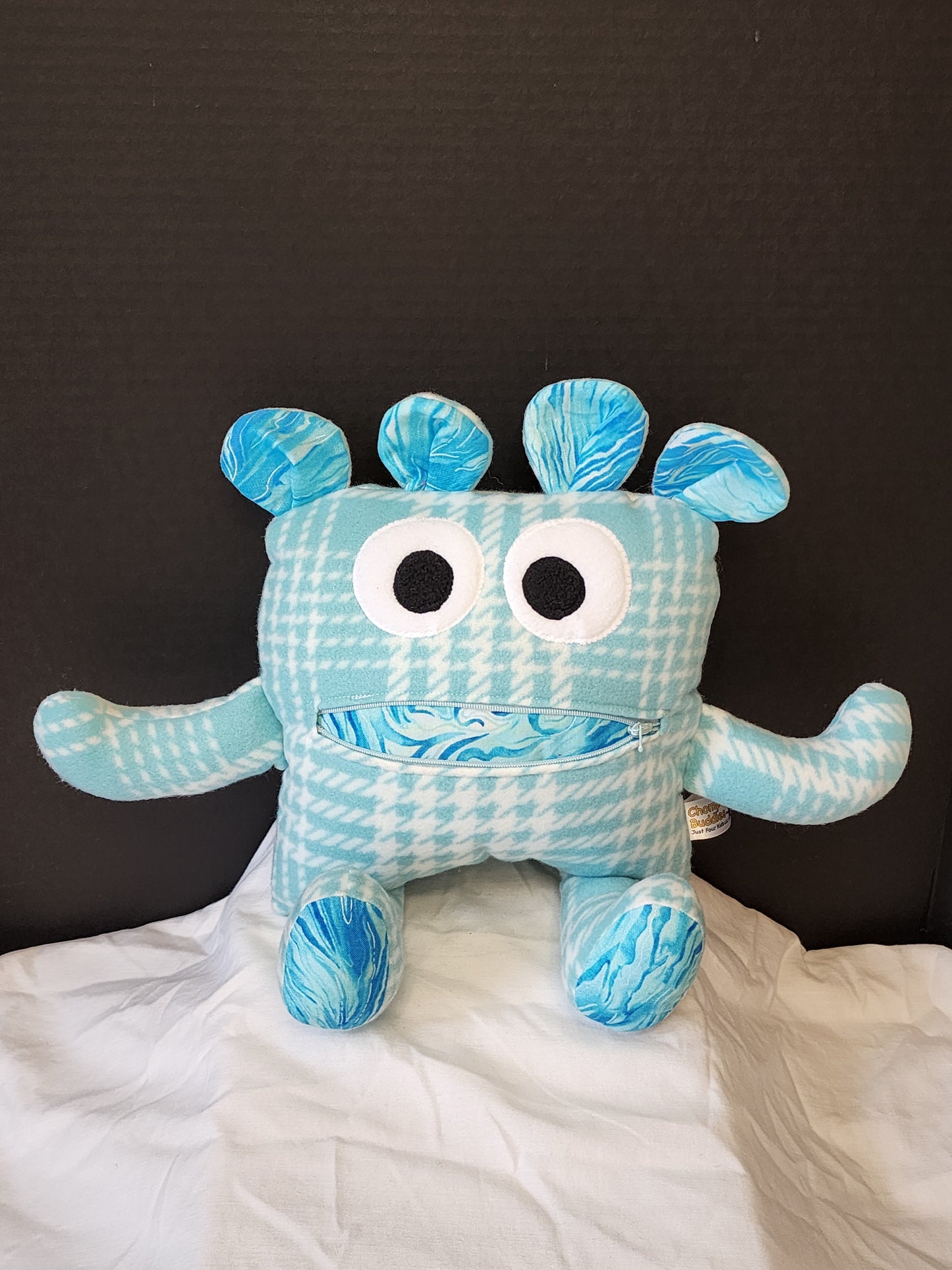 Chomper Buddy light teal plaid with blue splatter lining 14"