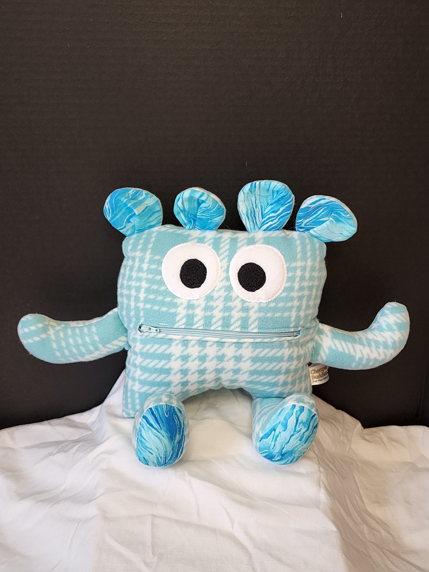 Chomper Buddy light teal plaid with blue splatter lining 14"